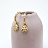 The Smiling Sun Charm