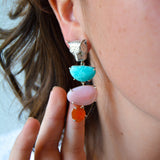 Close-up of a colorful leopard earring on a lady's ear with a blurred background