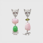 Pair of silver leopard-shaped earrings with pink and green stones on a light grey background