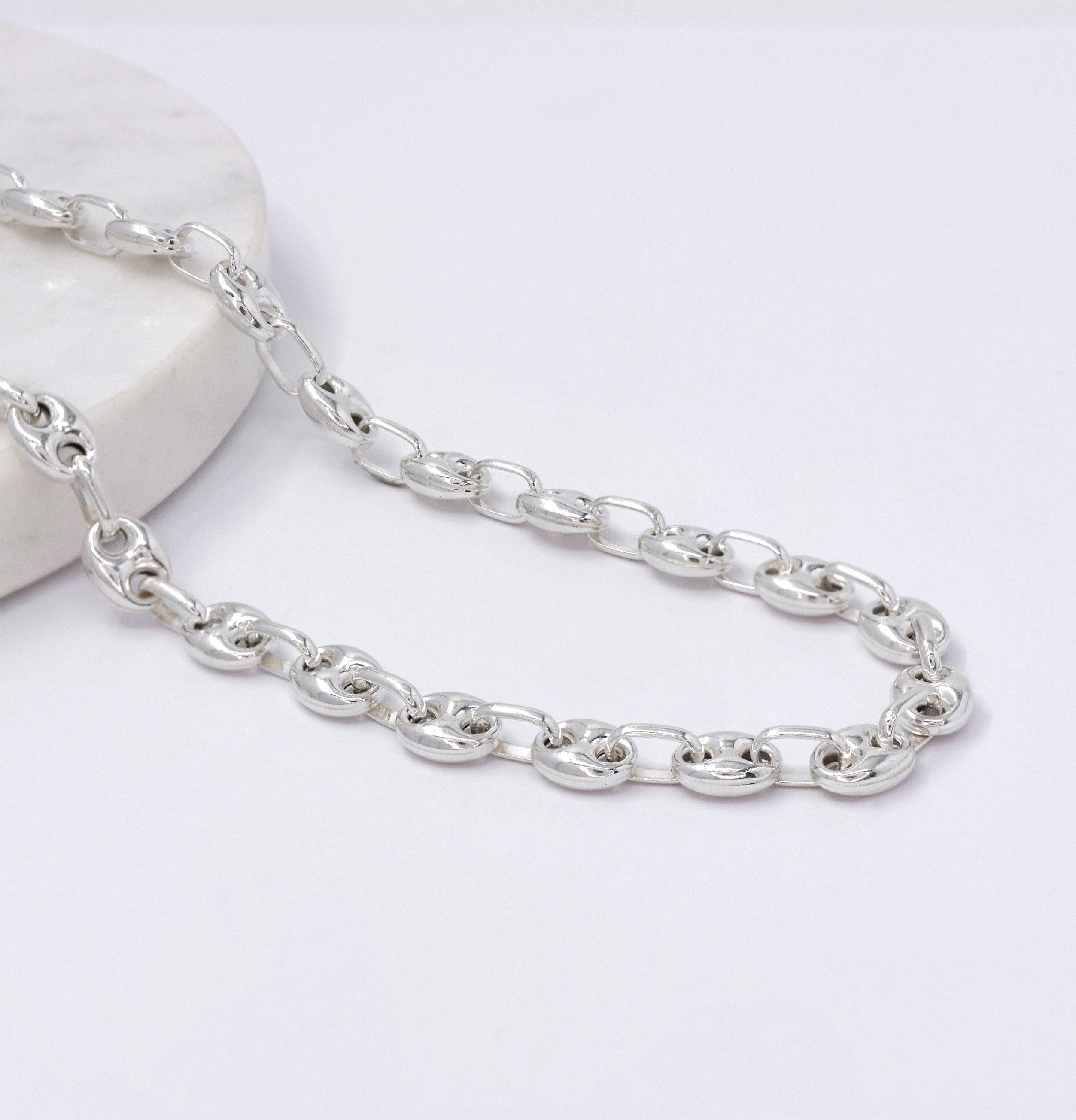 Silver Gucci chain necklace on a white background