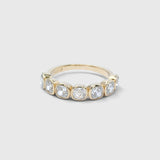 Coco wedding band in 9ct yellow gold with 3.5mm lab-grown cushion-cut diamonds in softly irregular tube settings
