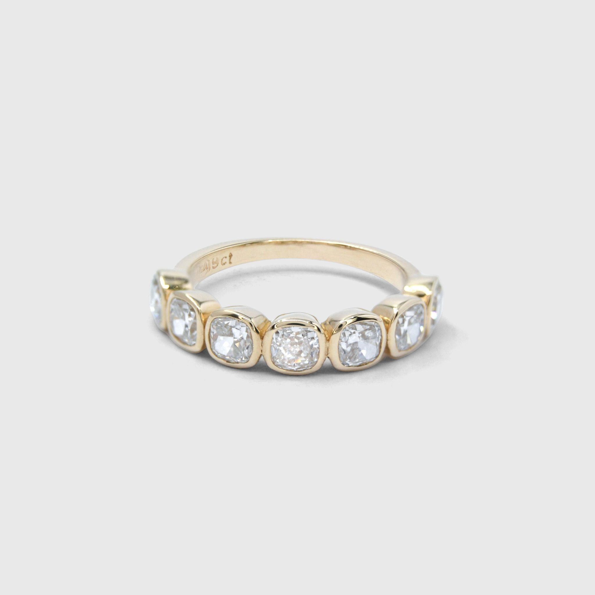 Coco wedding band in 9ct yellow gold with 3.5mm lab-grown cushion-cut diamonds in softly irregular tube settings