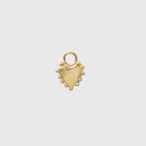 A small gold heart-shaped charm with a textured finish, a loop at the top, and small bead-like details along the bottom edge, centered on a light gray background.