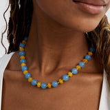 Sky-blue jade and butter-yellow agate bead necklace worn close around the neck