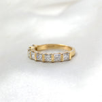 Nouveau lab-grown princess-cut diamond wedding band in 9ct yellow gold, side view on white satin