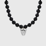 Black beaded necklace with a silver leopard face pendant on a white background