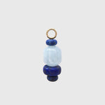 Riviera Blues Hoop Charm, a barrel-shaped aquamarine between deep blue lapis lazuli rondelles on a gold loop