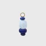 Riviera Blues Hoop Charm, a barrel-shaped aquamarine between deep blue lapis lazuli rondelles on a gold loop