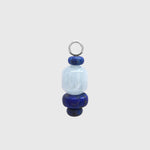 Hoop charm with a barrel-shaped aquamarine between deep blue lapis lazuli rondelles on a silver loop