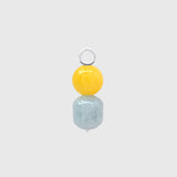 Hoop charm with a round mango jade bead above a barrel-shaped aquamarine on a silver loop
